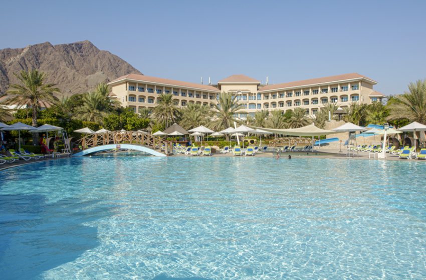  Unforgettable experience at Fujairah Rotana Resort & Spa with lush gardens, white sand beaches, and cascading waterfalls